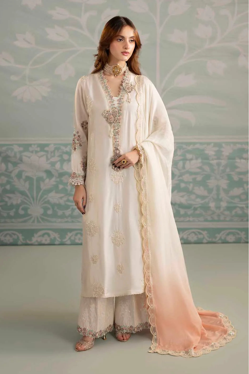 white silk dress pakistani This white dress is crafted from luxurious 80-gram pure silk and adorned  with delicate pearl work. The embellishment highlights the Sanan sleeves,  neckline, and flows gracefully across the entire