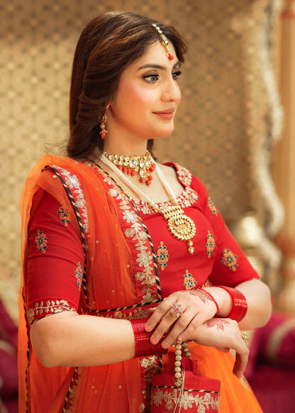 Orange Raw Silk Lehenga Choli with Potli