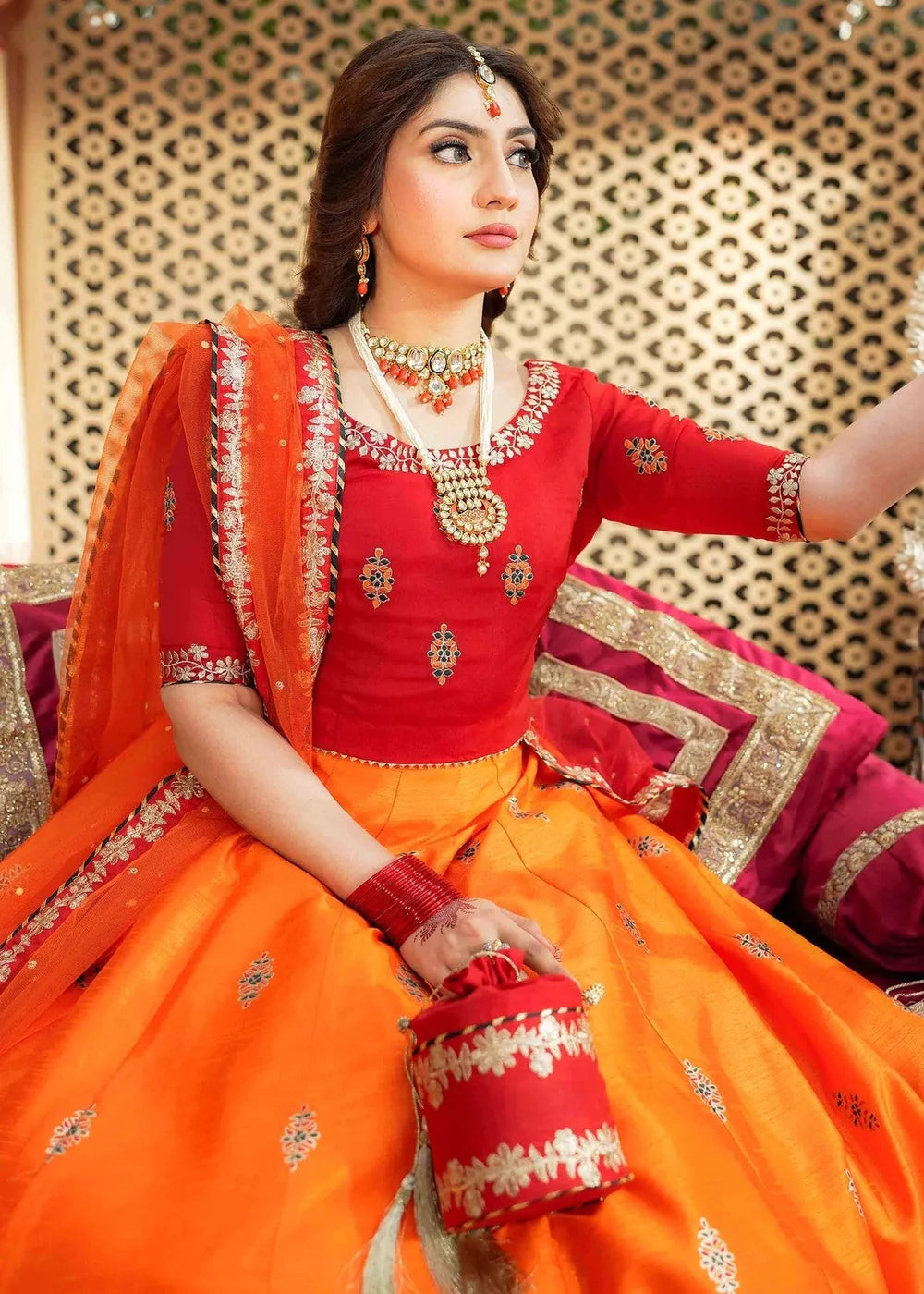 Orange Raw Silk Lehenga Choli with Potli