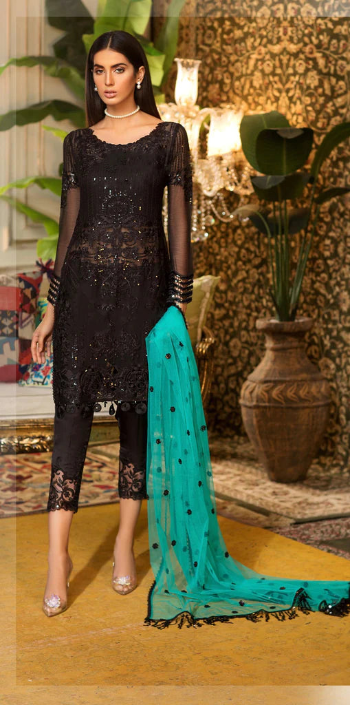 black dress with pink dupatta Black pleated suit set Simple kurta with boat neck and Plaso with a elegant contrast dupatta, hot pink fall and small crisis details with tassels on dupatta Fabric -